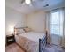 Cozy bedroom with natural light, neutral colors, and a comfortable queen-sized bed at 10929 Lassen Ct, Charlotte, NC 28214