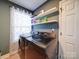 Convenient laundry room with new front load washer and dryer and shelves for storage at 10929 Lassen Ct, Charlotte, NC 28214