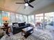 Bright sunroom with floor-to-ceiling windows and comfortable seating with outdoor patio access at 10929 Lassen Ct, Charlotte, NC 28214