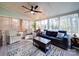Sunroom with a patterned rug, ample seating, and natural light coming from many windows at 10929 Lassen Ct, Charlotte, NC 28214