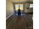 Traditional dining room with a wood table, chairs, dark floors, and natural light at 110 Amber Ln, Statesville, NC 28677