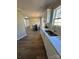 Bright kitchen featuring stainless steel appliances, white cabinets, and sleek countertops at 110 Amber Ln, Statesville, NC 28677