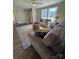 Bright living room featuring hardwood floors, neutral paint, and natural light from large windows at 110 Amber Ln, Statesville, NC 28677