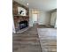 Cozy living room with stone fireplace, neutral walls, and modern flooring at 110 Amber Ln, Statesville, NC 28677