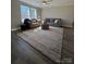 Spacious living room with hardwood floors, neutral walls, and natural light from large windows at 110 Amber Ln, Statesville, NC 28677