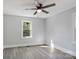 Bedroom with ceiling fan, neutral paint, and wood-look flooring at 112 Courtland St, Chester, SC 29706