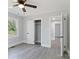 Neutral bedroom featuring two closets, grey walls, a ceiling fan, and contemporary flooring at 112 Courtland St, Chester, SC 29706