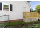 Side exterior view of a home featuring a fenced yard and deck at 112 Courtland St, Chester, SC 29706