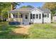 Charming one-story home with a cozy front porch and a well-maintained lawn at 112 Courtland St, Chester, SC 29706