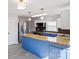 Modern kitchen with butcher block countertops, stainless steel appliances, and blue painted cabinets at 112 Courtland St, Chester, SC 29706