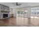 Spacious living room with wood floors, fireplace, and sliding glass doors to a covered porch at 117 Mills Garden Rd, Statesville, NC 28625