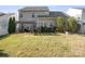 Expansive backyard featuring a pergola-covered patio perfect for outdoor relaxation and entertainment at 11711 Royal Castle Ct, Charlotte, NC 28277