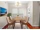 Dining room with a modern table and four chairs at 11711 Royal Castle Ct, Charlotte, NC 28277