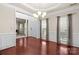 Spacious dining room boasts hardwood floors, neutral wall color and plenty of natural light at 11711 Royal Castle Ct, Charlotte, NC 28277