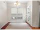 Bright dining area with a large window and neutral walls at 11711 Royal Castle Ct, Charlotte, NC 28277