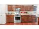 Updated kitchen featuring a stainless steel range, custom cabinets, and granite countertops at 11711 Royal Castle Ct, Charlotte, NC 28277