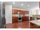 Spacious kitchen featuring stainless steel appliances, custom cabinetry, and granite countertops at 11711 Royal Castle Ct, Charlotte, NC 28277