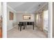 Elegant living room with a grand piano, carpet and neutral tones, creating a refined atmosphere at 11711 Royal Castle Ct, Charlotte, NC 28277