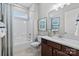 Clean bathroom featuring a shower and bath, marble countertops, and a large mirror at 126 Goorawing Ln, Mooresville, NC 28115