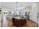 Beautiful kitchen featuring a large kitchen island, hardwood floors, and stainless steel appliances at 126 Goorawing Ln, Mooresville, NC 28115