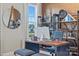 Home office with custom desk, shelving, rustic accents, and a window view at 126 Goorawing Ln, Mooresville, NC 28115