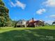 Spacious backyard featuring a deck and covered patio area at 130 Scism Rd, Kings Mountain, NC 28086