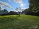 Large grassy backyard with mature tree and shed at 130 Scism Rd, Kings Mountain, NC 28086