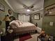 Comfortable bedroom with a ceiling fan, neutral paint, and charming decorative touches, cozy ambiance at 130 Scism Rd, Kings Mountain, NC 28086