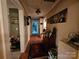 Hallway with hardwood floors features paneled doors and Gathering photos on the beige walls at 130 Scism Rd, Kings Mountain, NC 28086