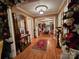 Welcoming hallway offering a glimpse into a beautifully decorated dining area, elegant lighting at 130 Scism Rd, Kings Mountain, NC 28086
