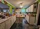 Functional kitchen with abundant counter space, white cabinetry, and bright green walls at 130 Scism Rd, Kings Mountain, NC 28086
