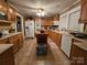 Traditional kitchen with wood cabinets, tiled floors, and stainless steel appliances at 130 Scism Rd, Kings Mountain, NC 28086