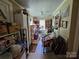 Walk-in pantry with white beadboard ceiling and tile floor is full of shelves and food items at 130 Scism Rd, Kings Mountain, NC 28086