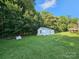 Spacious yard featuring a shed and mature trees at 130 Scism Rd, Kings Mountain, NC 28086