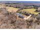 Aerial view of a home on a large lot surrounded by trees and green fields, located on State Hwy 55 at 13546 W Highway 55 W Hwy, York, SC 29745