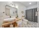 Modern bathroom featuring a vessel sink, wood accents, and a tiled shower at 13546 W Highway 55 W Hwy, York, SC 29745