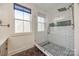 Stylish bathroom with a walk-in shower, white subway tile, and decorative patterned flooring at 13546 W Highway 55 W Hwy, York, SC 29745
