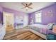 Purple bedroom with natural light from the window, and white trim around the doors at 13546 W Highway 55 W Hwy, York, SC 29745