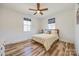 Bright bedroom features hardwood floors, a ceiling fan, and two windows at 13546 W Highway 55 W Hwy, York, SC 29745