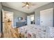 A bedroom with wood-style flooring, gray walls, and white trim with views of other rooms at 13546 W Highway 55 W Hwy, York, SC 29745