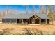 Beautiful modern farmhouse with dark siding, a covered porch, and a dormant lawn at 13546 W Highway 55 W Hwy, York, SC 29745