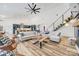 Open living area with high ceilings, modern furniture, and a staircase with metal railing at 13546 W Highway 55 W Hwy, York, SC 29745