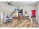 Spacious living room with a fireplace, comfortable seating, and an open staircase to the upper level at 13546 W Highway 55 W Hwy, York, SC 29745