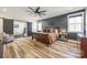 Serene main bedroom with a large bed, sliding barn door to bathroom, and dark accent wall at 13546 W Highway 55 W Hwy, York, SC 29745