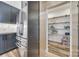 Modern kitchen with stainless steel appliances and a walk-in pantry featuring custom shelving at 13546 W Highway 55 W Hwy, York, SC 29745