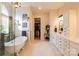 Elegant bathroom featuring a clawfoot tub, marble floors, and vanity with ample storage at 152 Bay Shore Loop, Mooresville, NC 28117