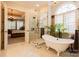 Bright bathroom featuring a garden tub, glass enclosed shower and a view into the main bedroom at 152 Bay Shore Loop, Mooresville, NC 28117