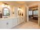 Bright bathroom with double sinks, ample storage and marble countertops at 152 Bay Shore Loop, Mooresville, NC 28117