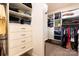 Organized walk-in closet with custom shelving, drawers and ample storage space for clothing and accessories at 152 Bay Shore Loop, Mooresville, NC 28117