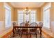 Formal dining room features hardwood floors, plantation shutters and a chandelier at 152 Bay Shore Loop, Mooresville, NC 28117